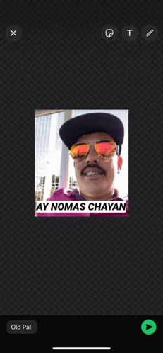 a man wearing sunglasses and a hat has ay nomas chayan written on his face