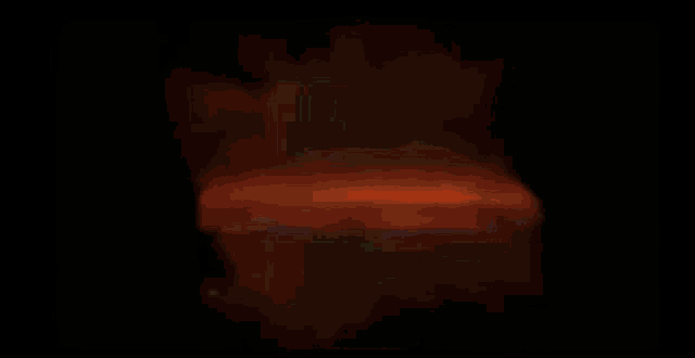 a close up of a gun with flames coming out of it