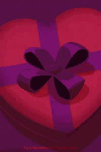 a heart shaped box with three chocolates that say i love you
