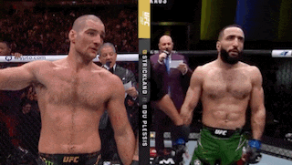 two men are standing next to each other in a ufc match