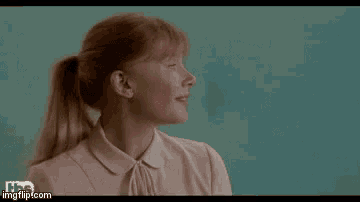 a woman is smiling and says `` thank you '' .