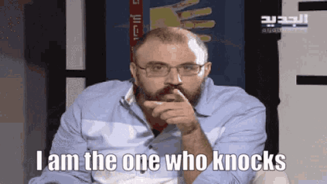 a man with a beard and glasses says i am the one who knocks