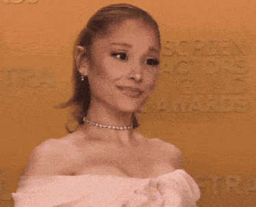 ariana grande is wearing a white off the shoulder dress and a choker