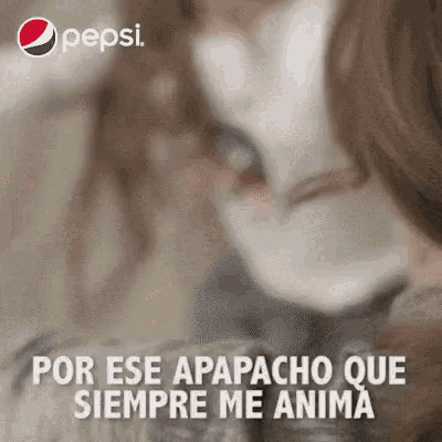 a pepsi ad shows a woman holding a cat and says por ese apapacho que siempre me anima .