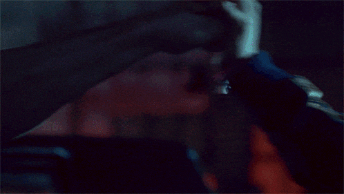 a person wearing a pink hat and a blue jacket has glowing eyes