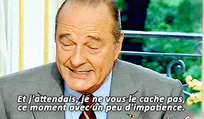 a man in a suit and tie says et j'attendais je ne vous le cache pas ce moment avec un peu d'impatience