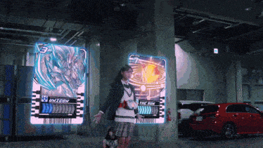 a girl stands in front of a display that says unitcon