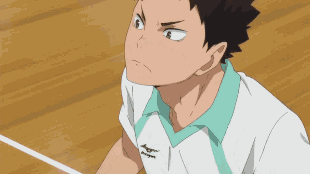 a man in a white shirt with mizuno written on the front