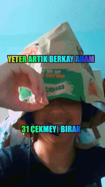 a person wearing a hat that says yeter artik berkay adam and 31 cekmeyi birak