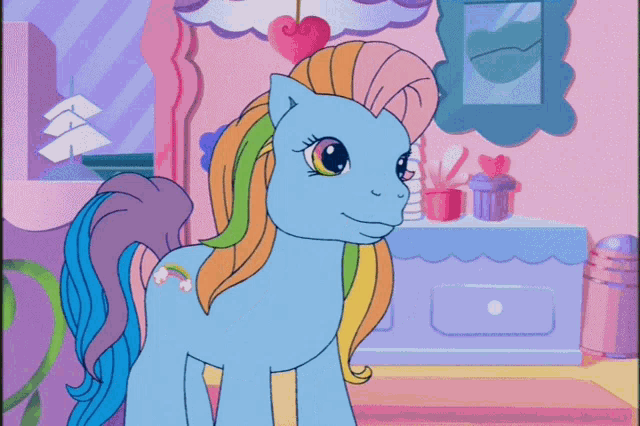 a cartoon pony with a rainbow mane and tail