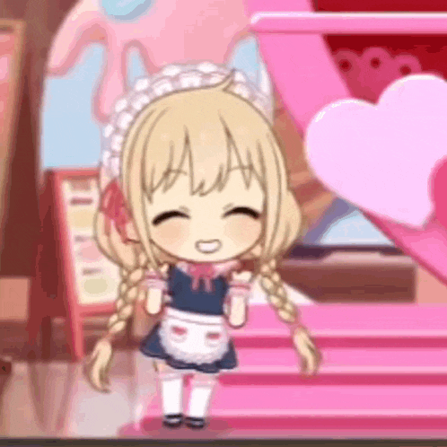 a little girl is wearing a maid costume and smiling .