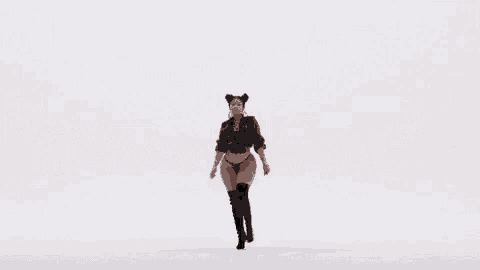 nicki minaj is wearing a fendi jacket and a fendi thong .