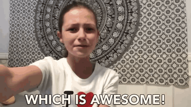 a girl taking a selfie with the words " which is awesome " above her