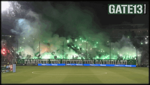 a soccer field with a banner that reads gate13