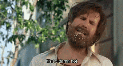 a man with a beard is making a funny face and saying `` it 's so damn hot ''