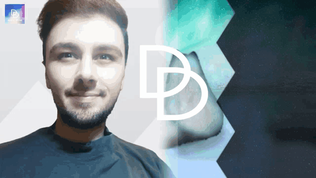 a man with a beard is smiling in front of a logo that has the letter b on it
