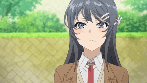 a girl with long hair and blue eyes is wearing a brown jacket and tie