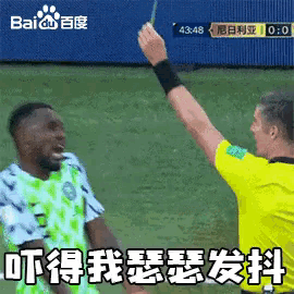 a referee is giving a yellow card to a soccer player with a baidu logo in the background
