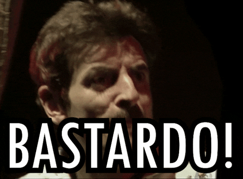 a man with a mustache is behind a sign that says bastard on it