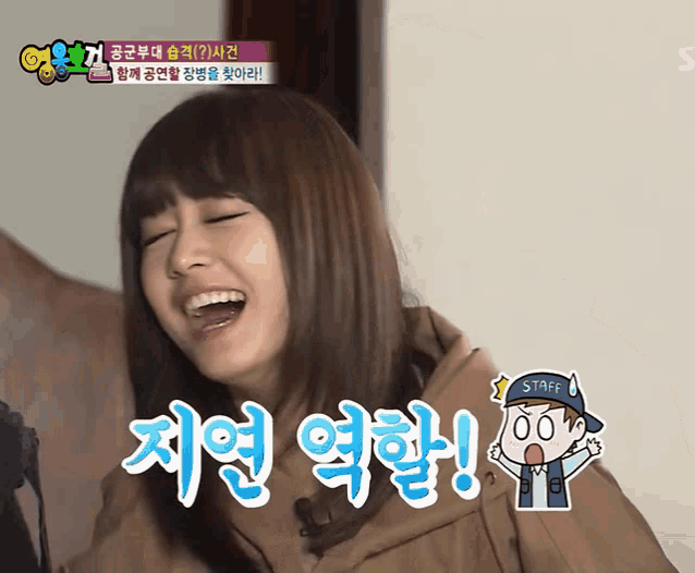 a girl with korean writing on her face and a cartoon of a man with the word staff on his hat