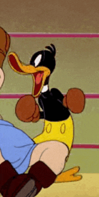 a cartoon duck is wearing boxing gloves and kicking a person .