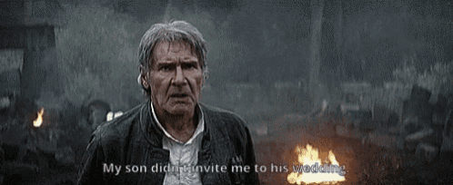 a man is standing in front of a fire and saying `` my son didn t invite me to his wedding '' .