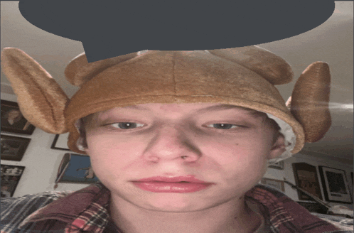 a person wearing a turkey hat with a speech bubble above it