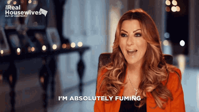 a woman says " i 'm absolutely fuming " in front of a real housewives logo