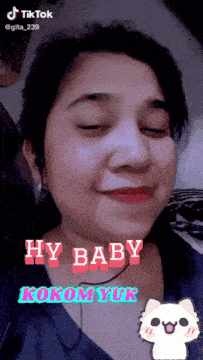 a close up of a woman 's face with the words hy baby kokom yuk