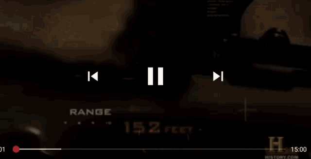 a person holding a sniper rifle with the range 152 feet