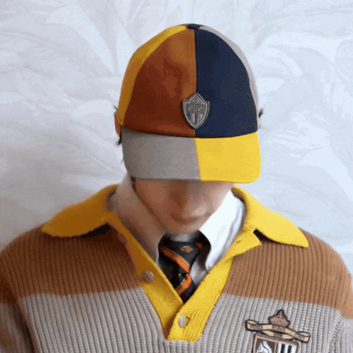 a man wearing a hat that says r.i.p. on the front