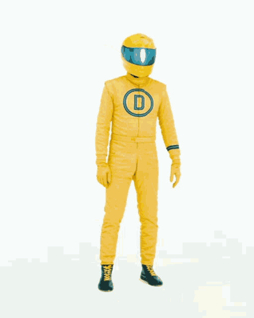 a man in a yellow suit is dancing in front of the word oh yes