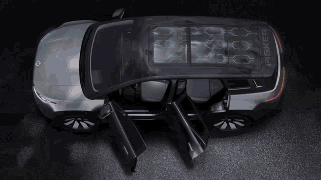 a fisker car with its doors open and the roof open