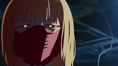 a woman with a red mask on her face looks at the camera