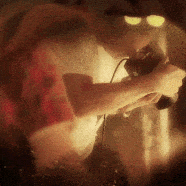 a blurry picture of a man holding a camera
