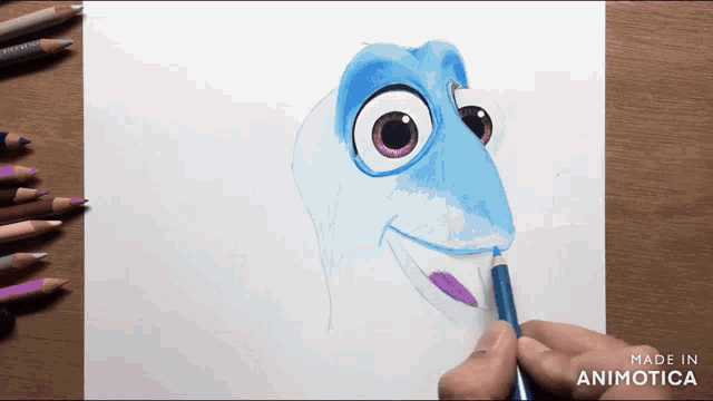 a person is drawing a cartoon character with colored pencils on a piece of paper that says made in animatica on the bottom