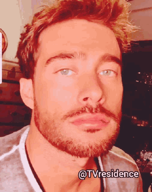 a close up of a man 's face with the words @tvresidence on the bottom right
