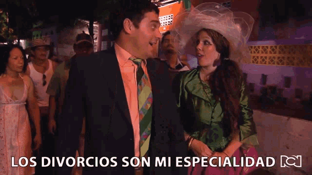 a man and a woman are standing next to each other with the words los divorcios son mi especialidad below them