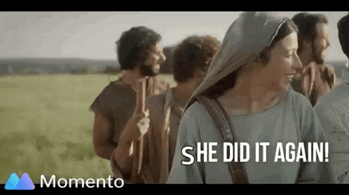 a group of people are standing in a field and a woman is smiling and saying she did it again .