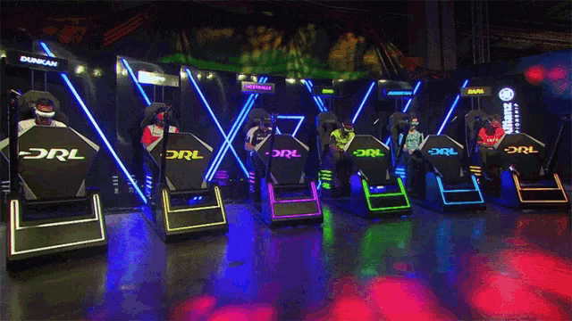 a group of people sitting in chairs that say drl on them