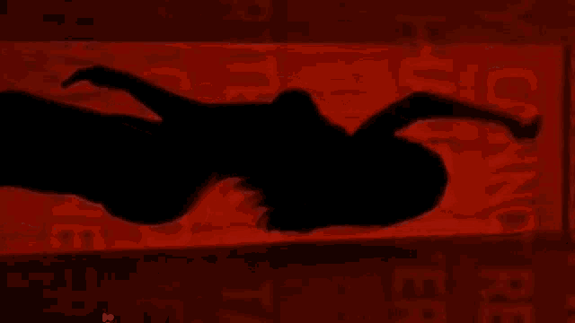 a silhouette of a woman in front of a sign that says " for us "