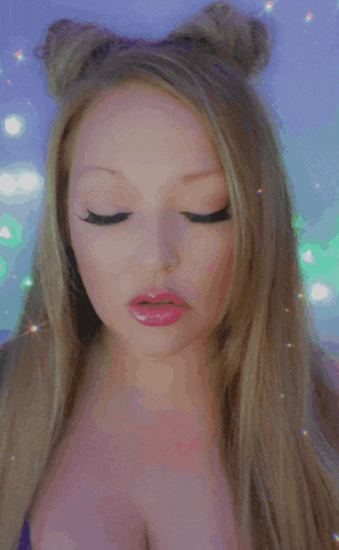 a woman blowing a kiss with a purple background