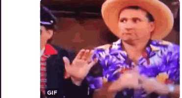 a man wearing a cowboy hat and a hawaiian shirt is making a funny face .