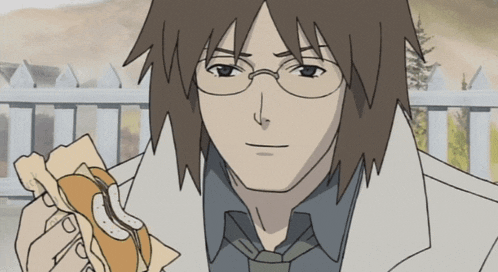 a man with glasses is eating a sandwich