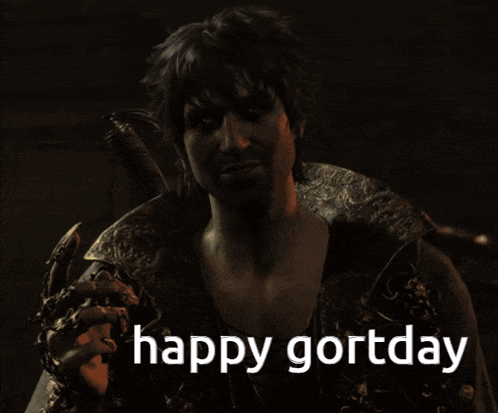a man holding a sword with the words happy gorzday behind him