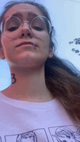 a girl with glasses and a tattoo on her neck has the number 3 on it
