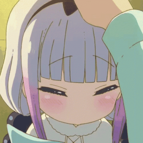 a close up of a person holding a girl 's head with her eyes closed