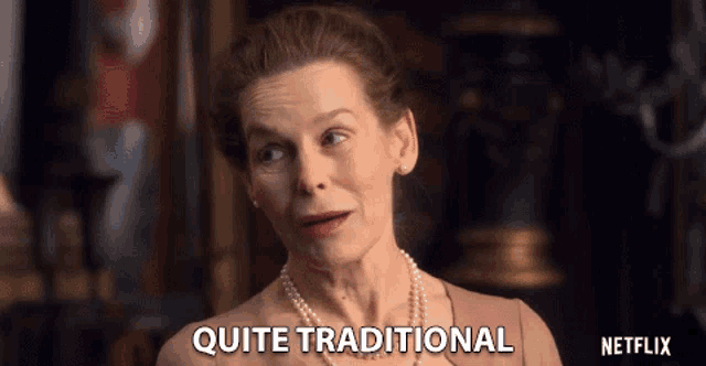 a woman with a pearl necklace says quite traditional in front of a netflix logo