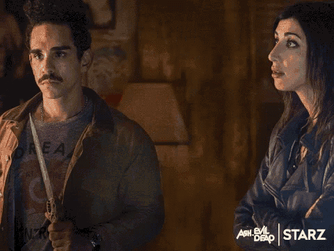 an advertisement for ash evil dead shows a man and a woman