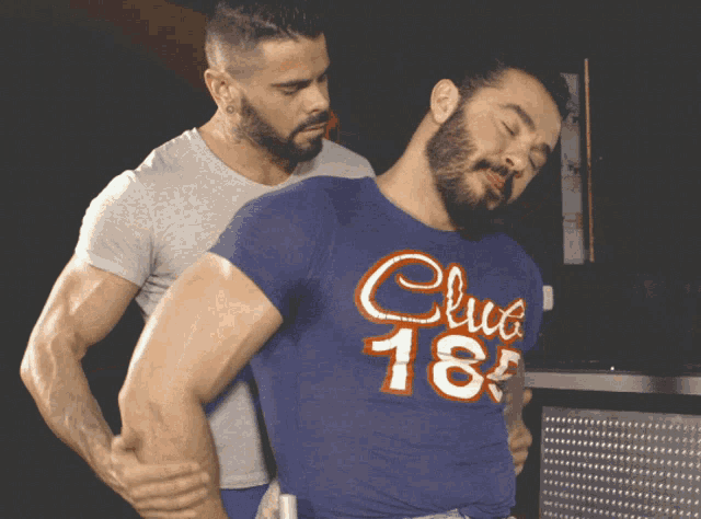 a man in a blue shirt that says club 18